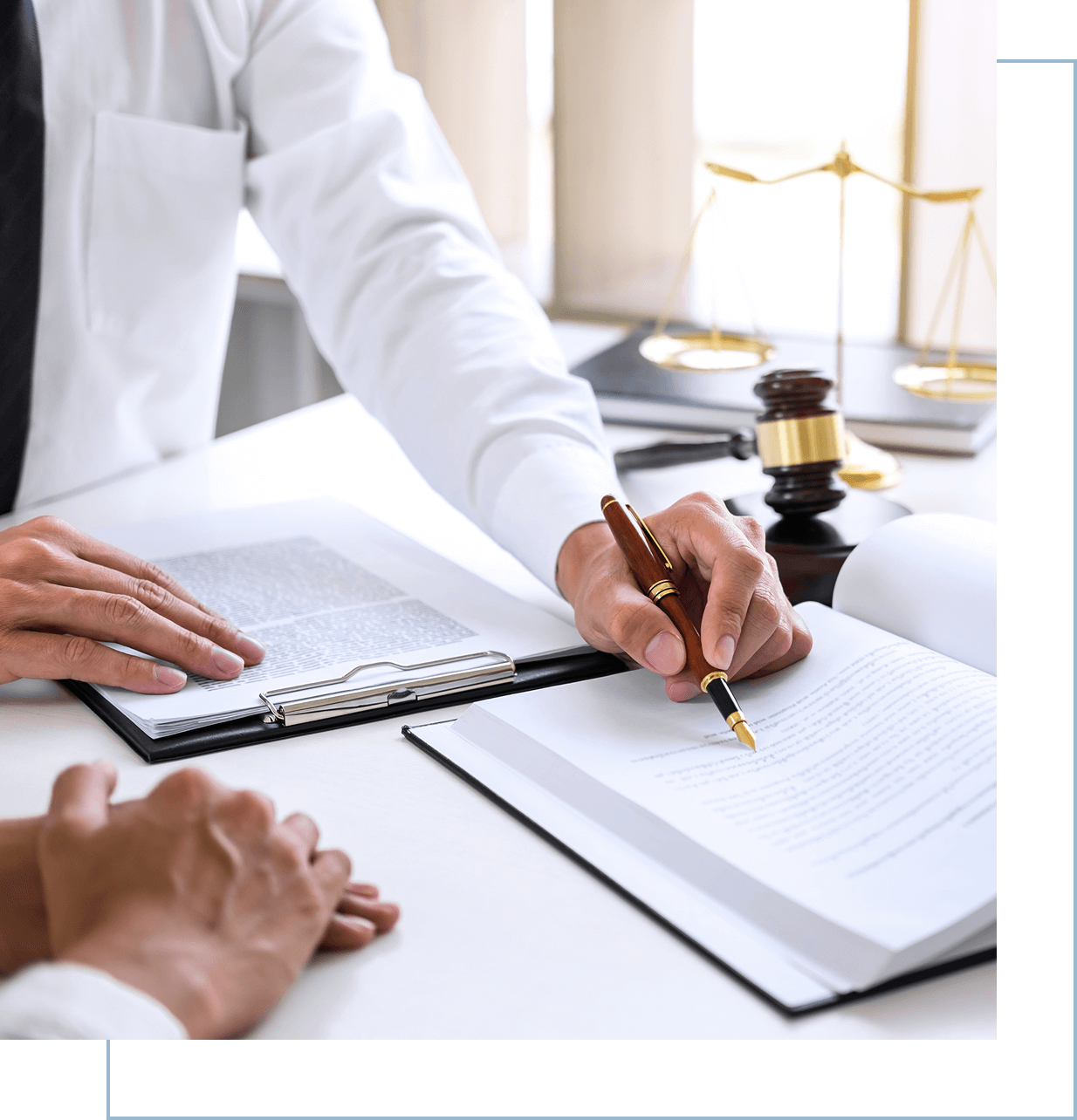 Group 601 Lawyer and client reviewing legal documents.